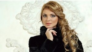 Fashionable mouton fur coat with a hood